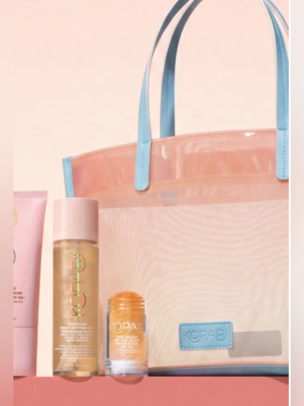 Kopari Blush Pink Tote with Baby Blue Handles, still in the bag